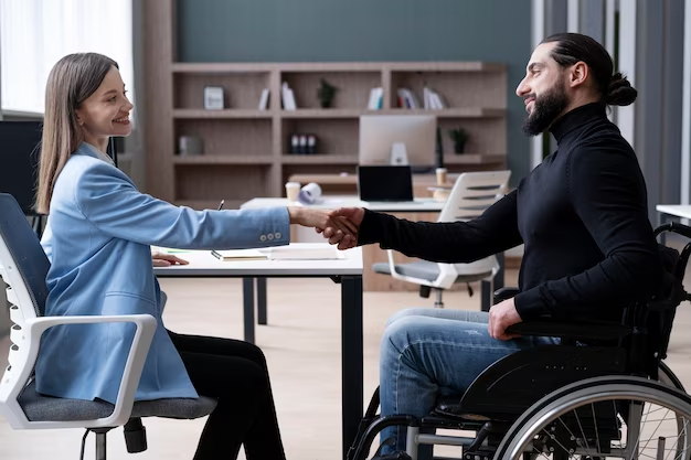 Woman shaking hands with a disabled man