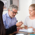 Woman conversing with elderly man