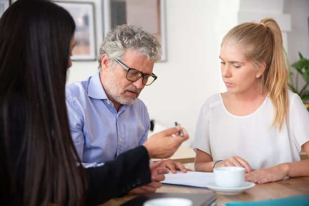 Woman conversing with elderly man